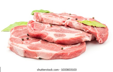 Three raw pork neck meat cuts with black pepper and three bay leaves isolated on white background fresh slices without bone 