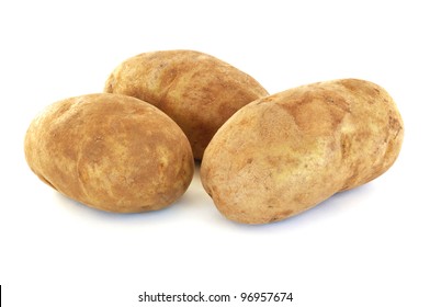 Three Raw Russet Potatoes Isolated on White - Shutterstock ID 96957674