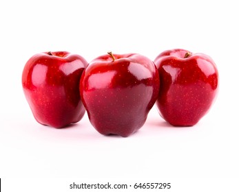 Three Red Apples On A White Background