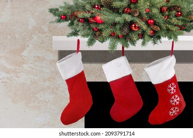 Three Red Christmas Stockings On Fireplace Mantle