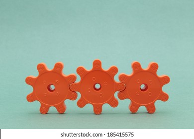 Three Red Plastic Gears