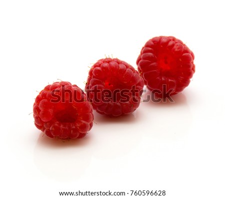 Three red raspberries isolated on white background in row
