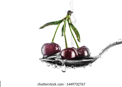 Three Red Sweet Cherry Berries In A Tablespoon With Drops Of Water In A White Background In Horizontal Format