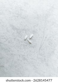 Three Rice Grains on Ceramic Surface