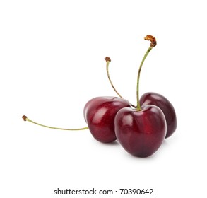 Three Ripe Black Cherries With Stems Isolated On White