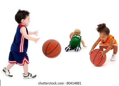 Three rival teams with balls in uniform over white. Toddler boy and girl child basketball players. - Powered by Shutterstock