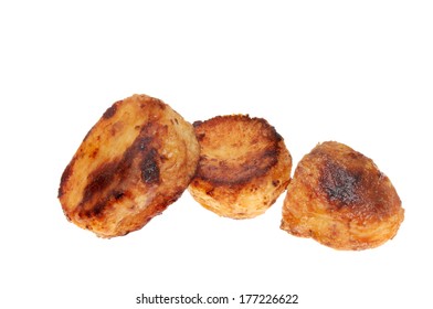 Three Roast Potatoes Isolated Against White