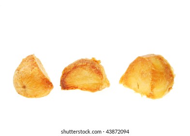 Three Roast Potatoes Isolated On White