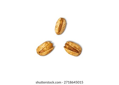 Three roasted pistachios are arranged in a triangular formation against a clean white background. The nuts are partially shelled, revealing their textured...