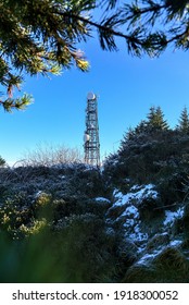 Three Rock TV Transmitter Antenna Viewed From Fairy Castle (Two Rock Mountain), Dublin Mountains, Ireland. Single Cellular Tower Top In Against Clear Blue Sky. Vertical Wide Angle View. Creative Shot