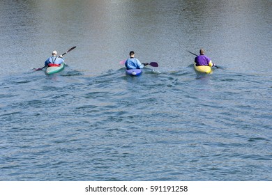 Three Rowers With Canoe Recreate In A Lake