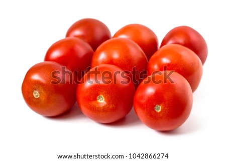 Three rows of red tomatoes on white isolated background
