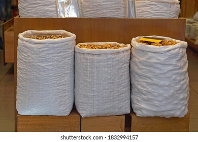 Three sacks filled with nuts bulk food