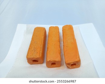 Three savory snacks isolated on white background. Food photography concept. Close up. Copy space. Selective focus. - Powered by Shutterstock