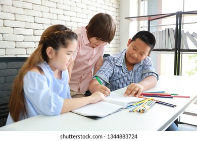 three school kids drawing in class (education concept)  - Shutterstock ID 1344883724