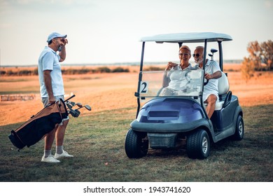 Three Senior Golfers Talking. Man And Woman In Golf Car.