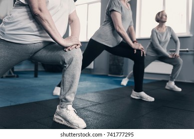 Three Senior Women Doing Lunge Exercises