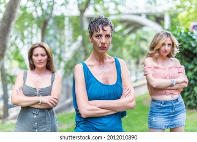 Three Serious Middle Aged Women Looking At Camera With Their Arms Crossed