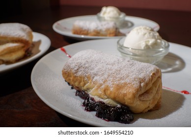 Three Servings Of Strudel With Ice Cream. Tasty And Not Bad Food.