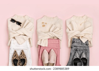 Three sets of clothes. Capsule wardrobe. Fashion Look. Jumpers with jeans and shoes. Fashion spring, autumn or winter outfit.  Women's stylish and elegant clothes. Flat lay, top view, overhead.	