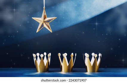 three shiny crowns and a star light in the sky. Epiphany and three kings day holiday celebration night banner. 6 January - Powered by Shutterstock