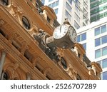 Three sided vintage clock on the Former General Post Office building now The Fullerton Hotel Sydney