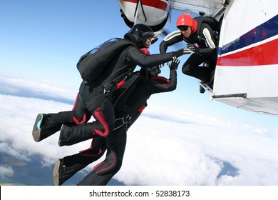 Three Skydivers Jump From A Plane