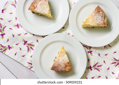 Three Slices Of Cheese Cake On Kitchen Table Cloth, Top View.