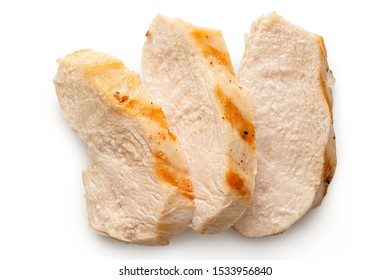Three slices of grilled chicken breast with grill marks isolated on white. Top view. - Shutterstock ID 1533956840