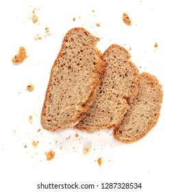 Three Slices Of Toast Bread With Crumbs Isolated On White Background. Cutted Wholegrain  Bread. Top View