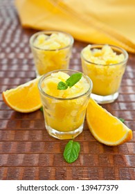 Three Small Glasses With Orange Granita / Sorbet