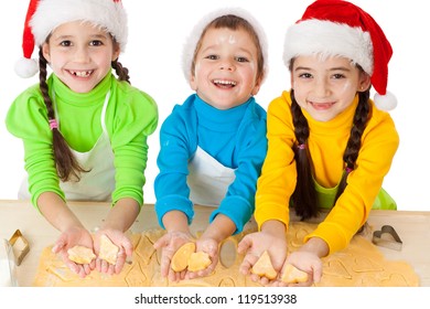 Three Smiling Kids Showing Dough For Christmas Cooking, Isolated On White