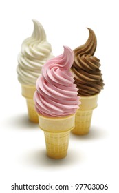 Three Soft Serve Ice Cream Cones In Vanilla, Strawberry And Chocolate