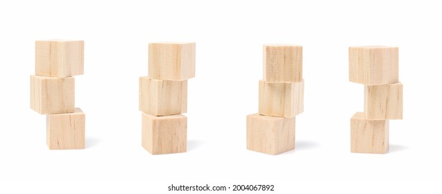 Three Stacked Geometric Wooden Cube Blocks. Isolated On A White Background.