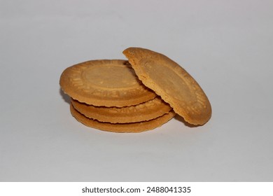 Three stacks of partially eaten butter caramel biscuits isolated on white background - Powered by Shutterstock