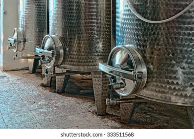 Three steel vats for wine 