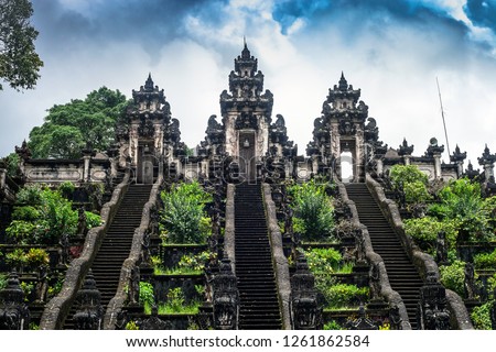 Three stone ladders in beautiful Pura Lempuyang Luhur temple. Summer landscape with stairs to temple. Paduraksa portals marking entrance to middle sanctum (jaba tengah) of Pura Penataran Agung, Bali