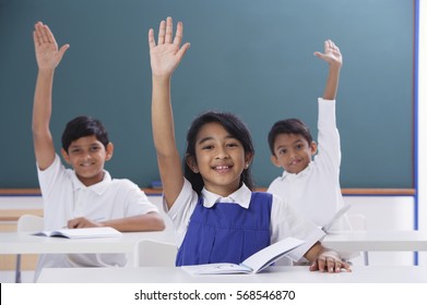 three-students-raised-hands-260nw-568546870.jpg