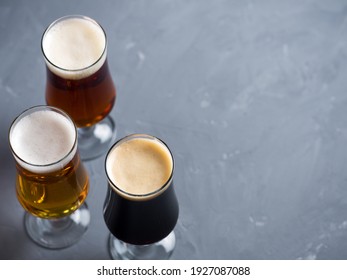 Three Styles Of Beer On The Table, Light Beer Lager, Amber Ale, Stout, Copy Space