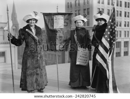 Three suffragettes demonstrate in New York City to promote Suffrage Hike of 1912 from Manhattan to Albany and distribute their VOTES FOR WOMEN PILGRIM leaflets.