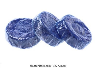 Three Tablets Of Blue Toilet Bowl Cleaner On White Background