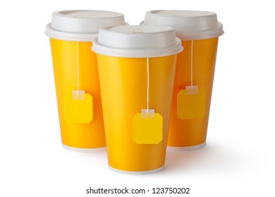 Three take-out teacups with teabags. Isolated on a white.