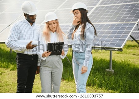Three technical engineers review plan on paper and discuss. men listen to woman's explanations about nuances of work.