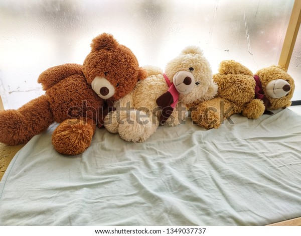 bed full of teddy bears