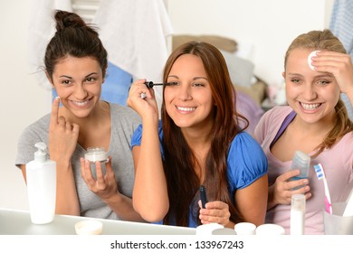 Three Teenager Girls Enjoying Getting Ready In The Bathroom