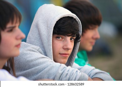 Three teenagers sat together - Shutterstock ID 128632589