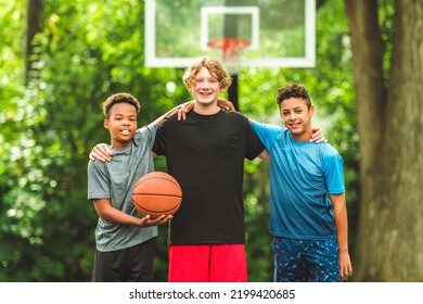 The Three Teens Friends In Sportswear Playing Basketball Game