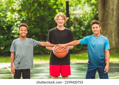 The Three Teens Friends In Sportswear Playing Basketball Game