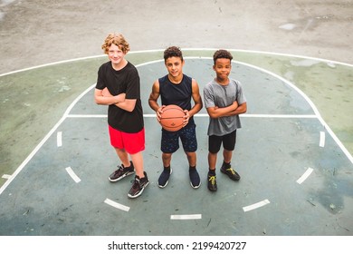 The Three Teens In Sportswear Playing Basketball Game