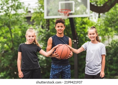 The Three Teens In Sportswear Playing Basketball Game